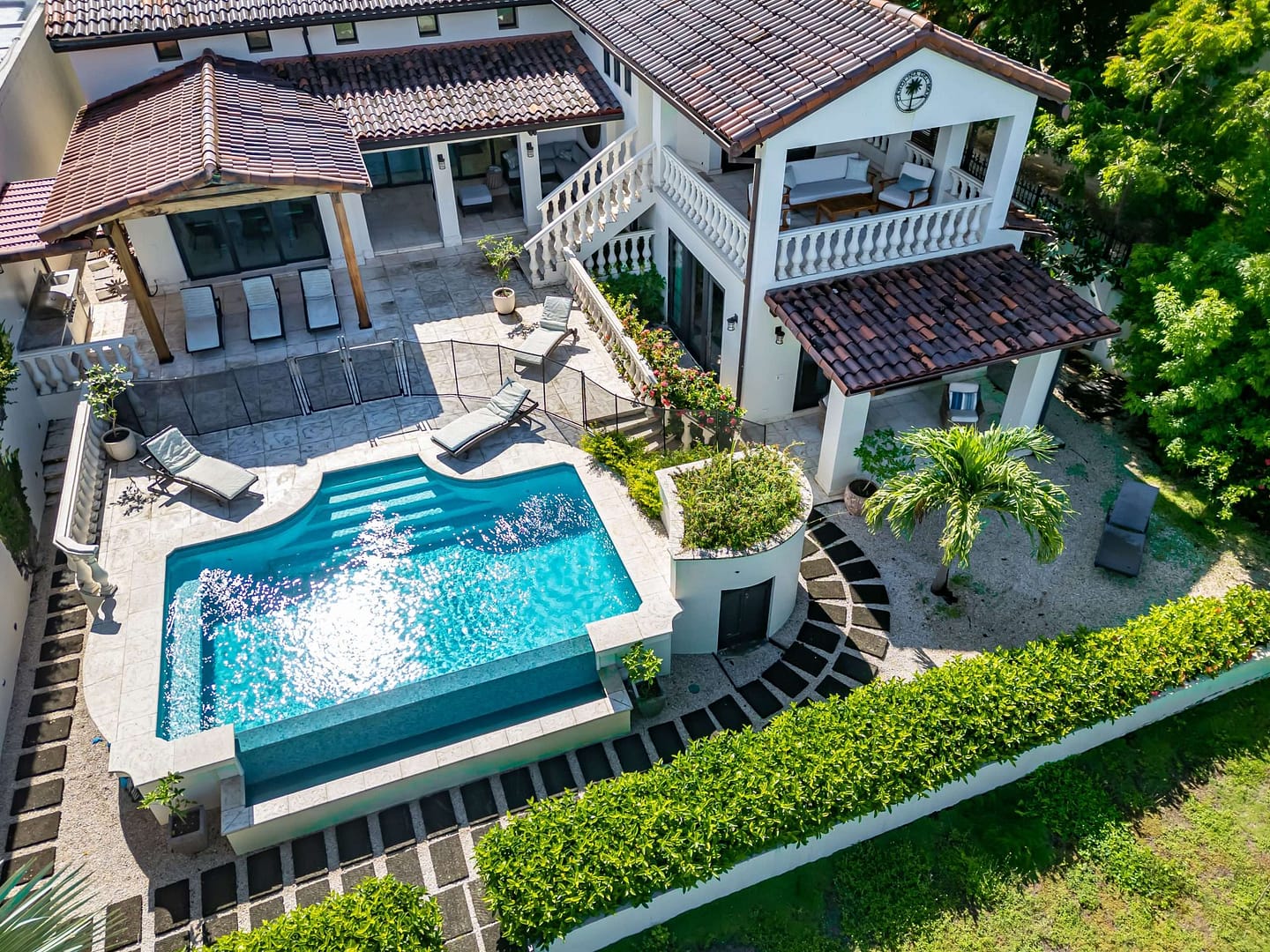 Drone image from above of Spanish colonial home Carolina del Mar with a pool