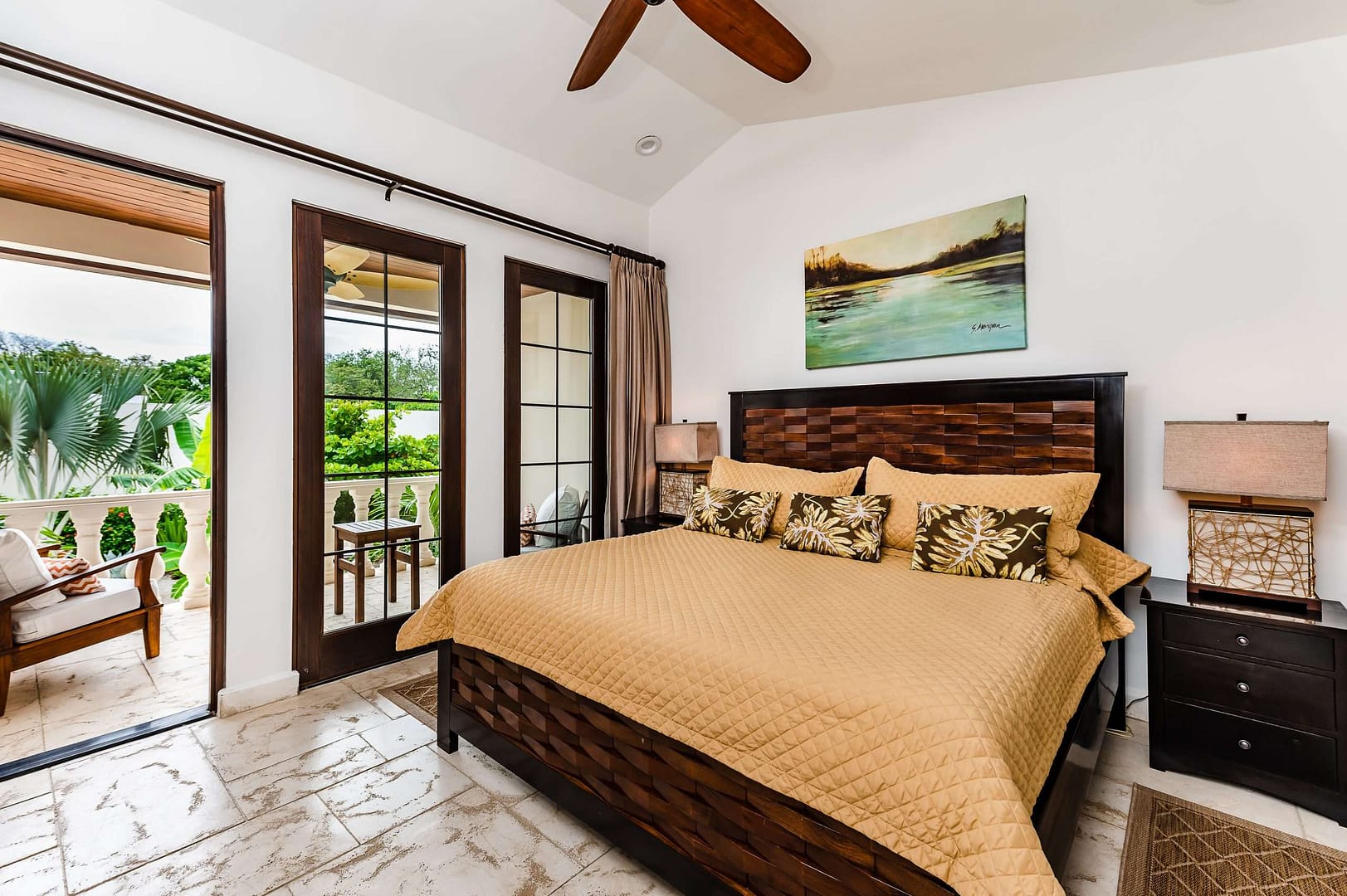 Guest bedroom with a private balcony at Carolina del Mar in Langosta, Costa Rica.