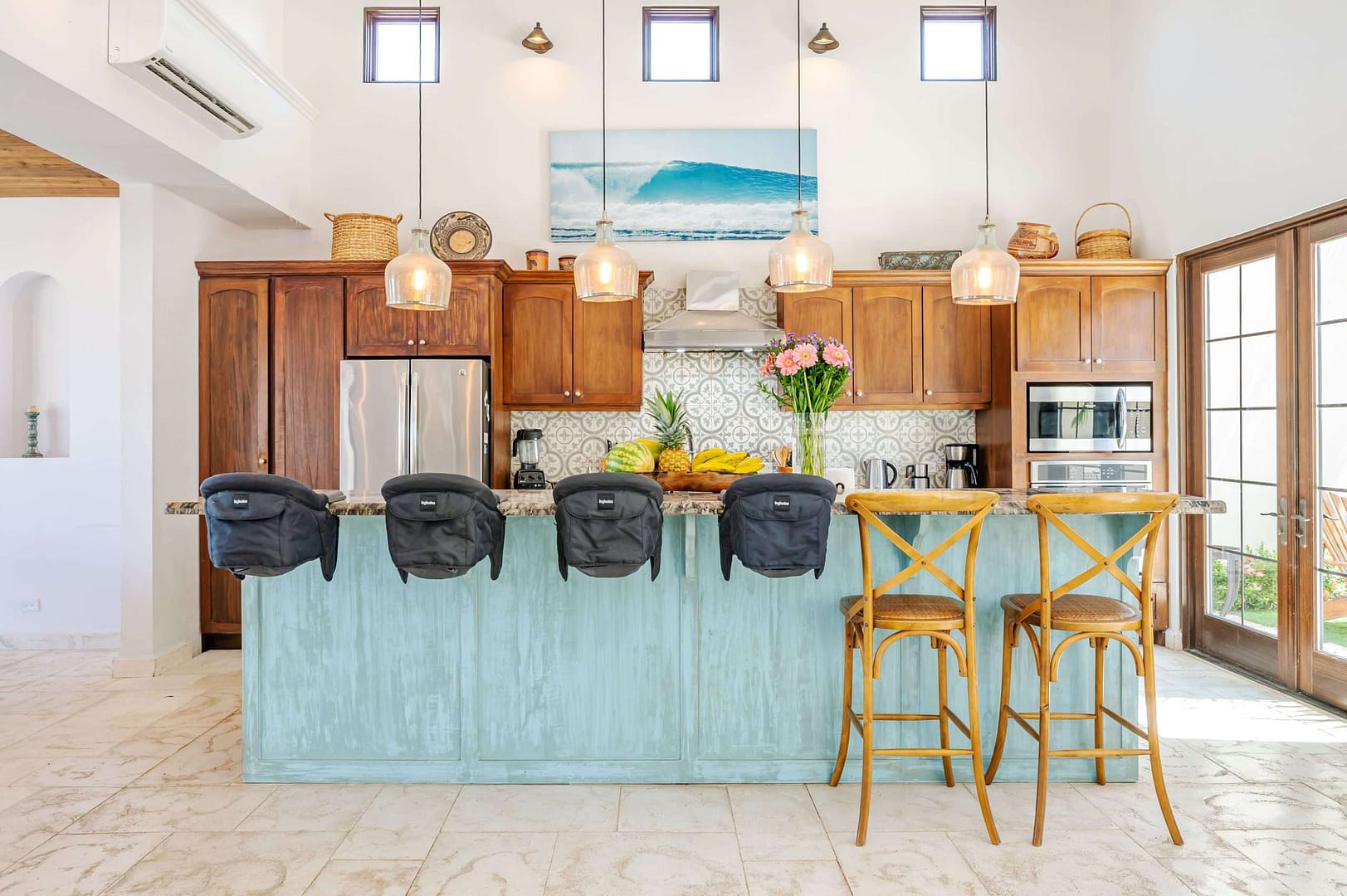 Carolina del Mar kitchen island with chairs and baby seats attached to the counter