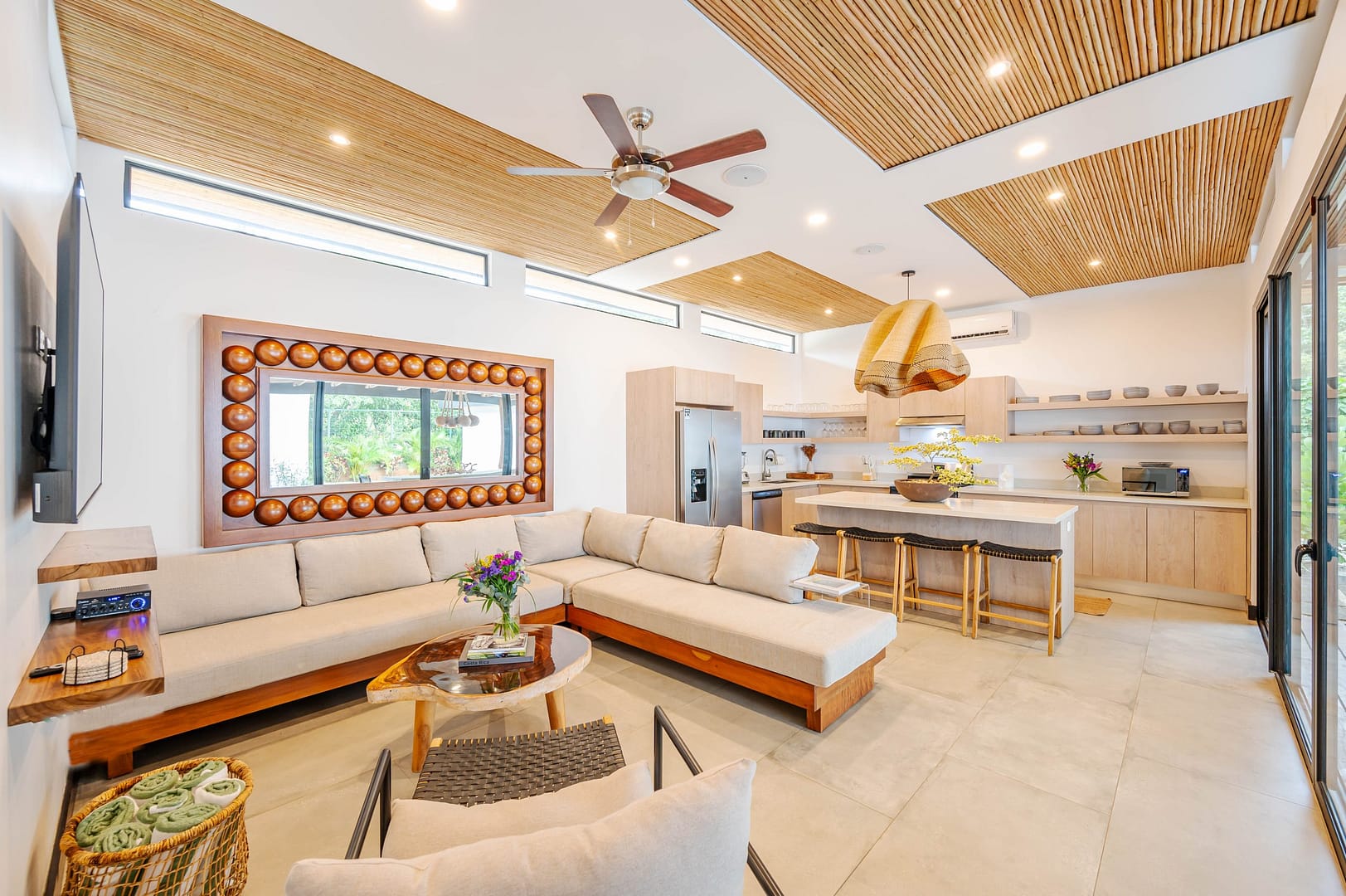 Living Room and kitchen view of a home, tropical modern design