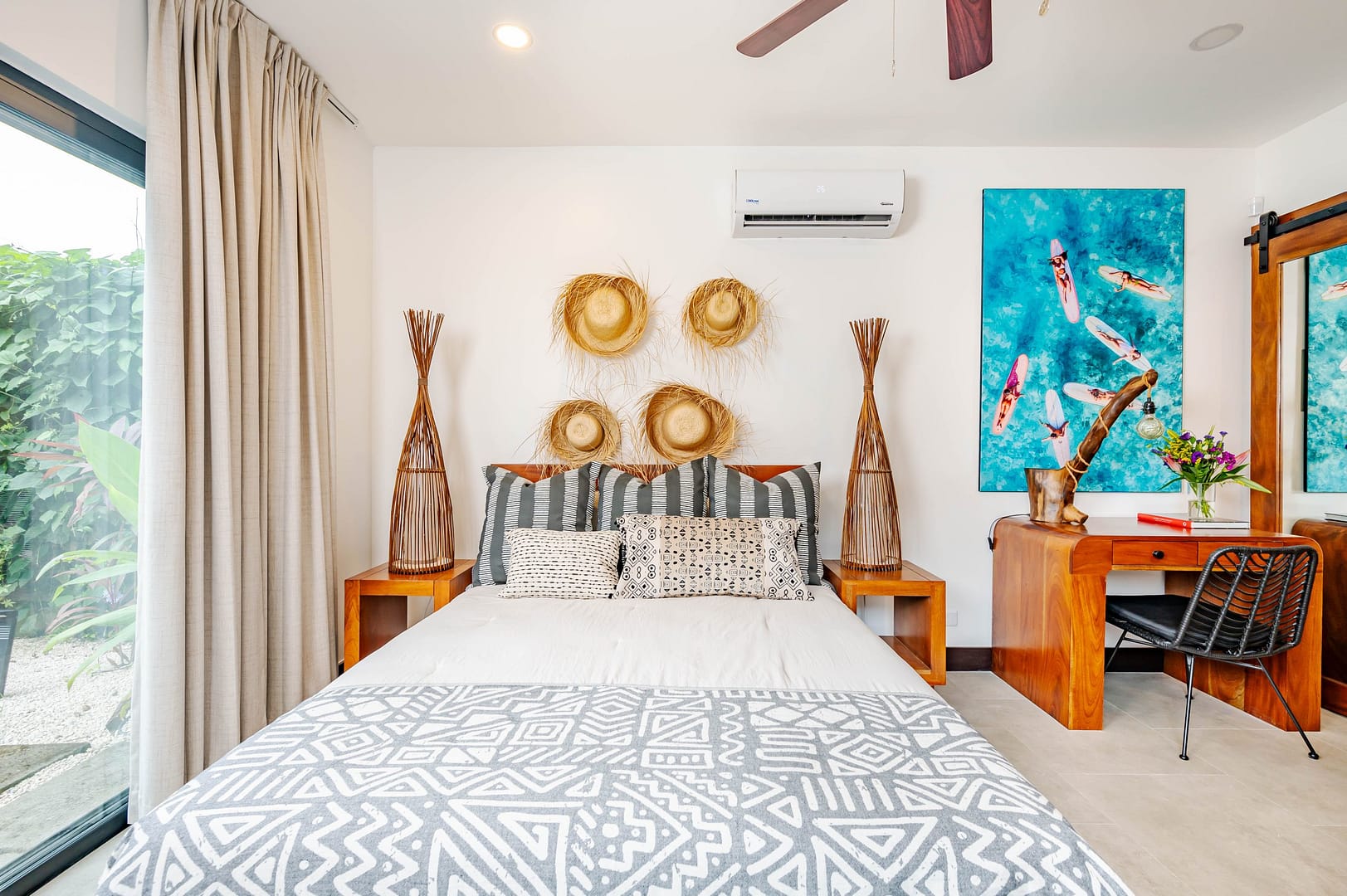 Bedroom and workspace with tropical beach themed decor