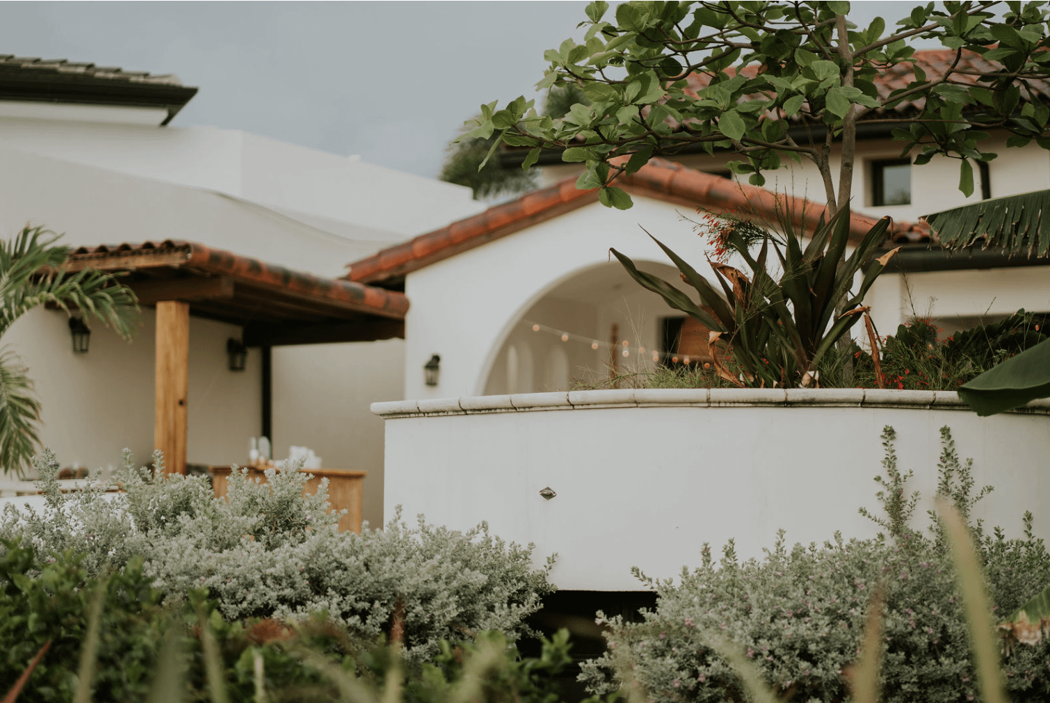 Spanish Colonial home balcony and surrounding greenery