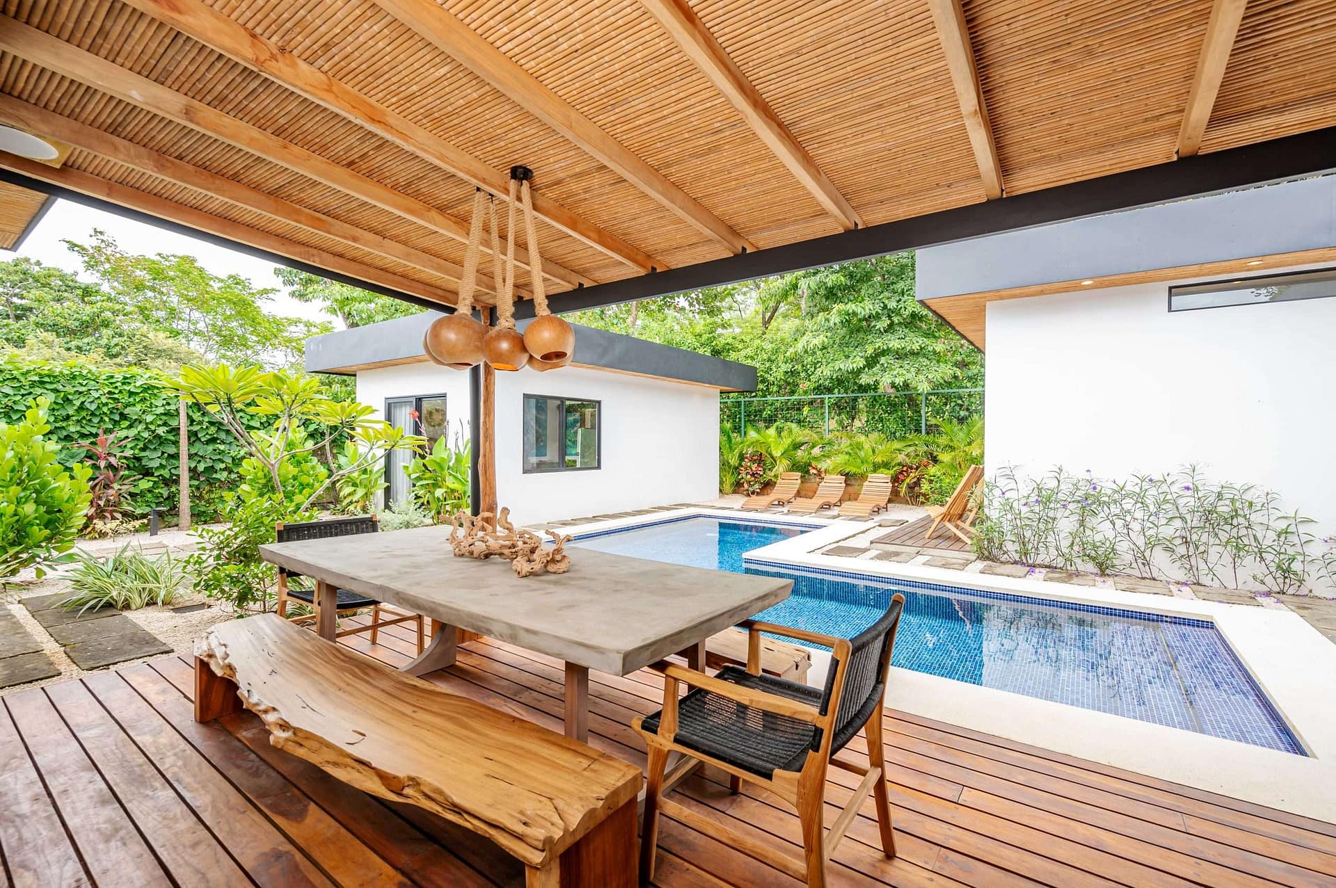 Outdoor Area with Pool and Dining Table